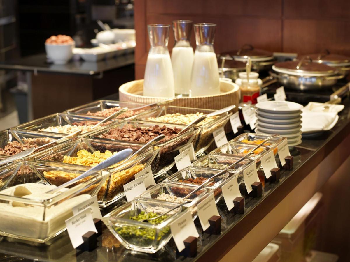 Conrad Hamburg Hotel Exterior photo A selection of cereals at a breakfast buffet